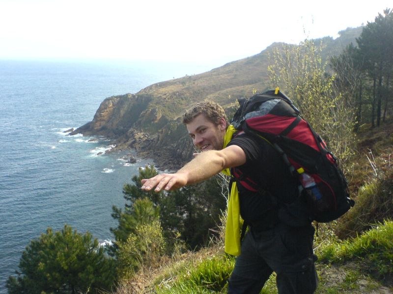 Chris smiling while hiking the camino de santiago in northern spain